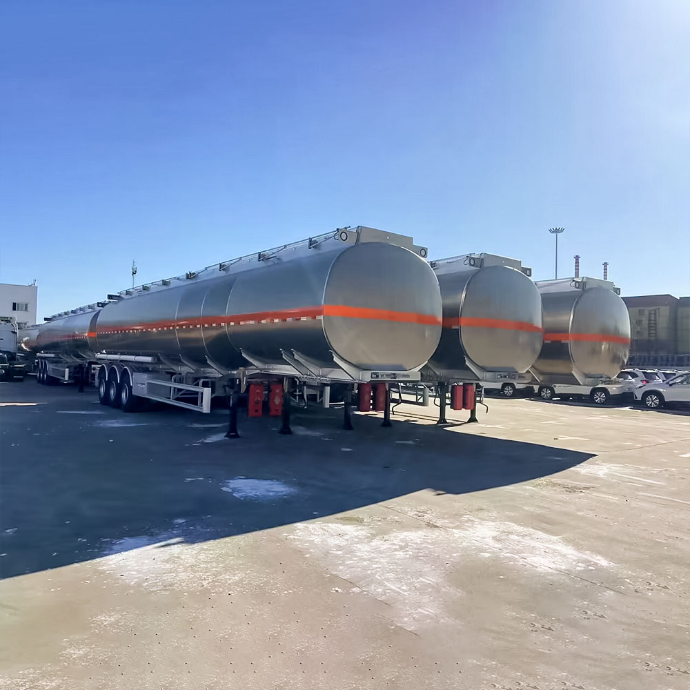 ZW 3 axle aluminum tanker semi trailer with raw alloy finish and orange stripe, optimized for long-distance oil transport.