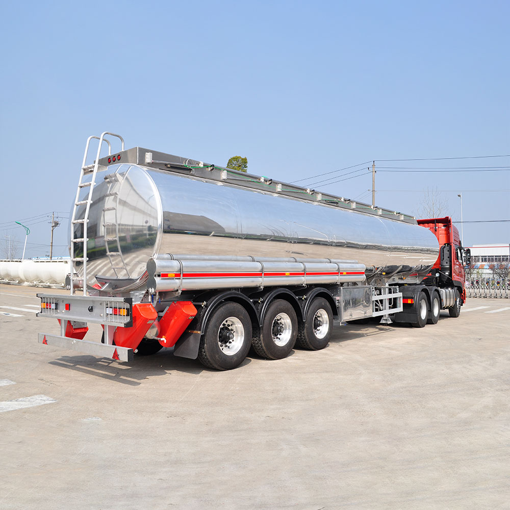 ZW 3 axle polished aluminum tanker trailer with high-capacity tank and lightweight alloy build for fuel and oil transport.