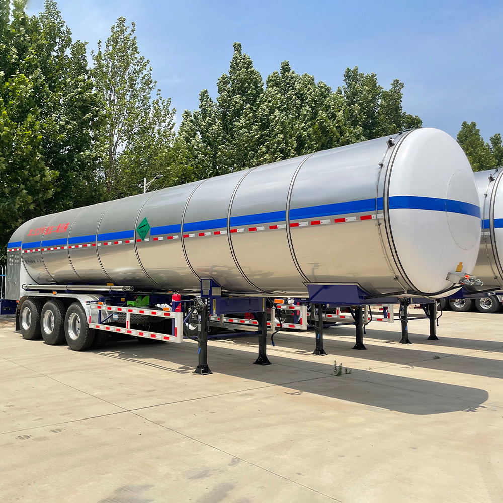 Triple-axle chemical trailer showing stainless steel tank and BPW axles