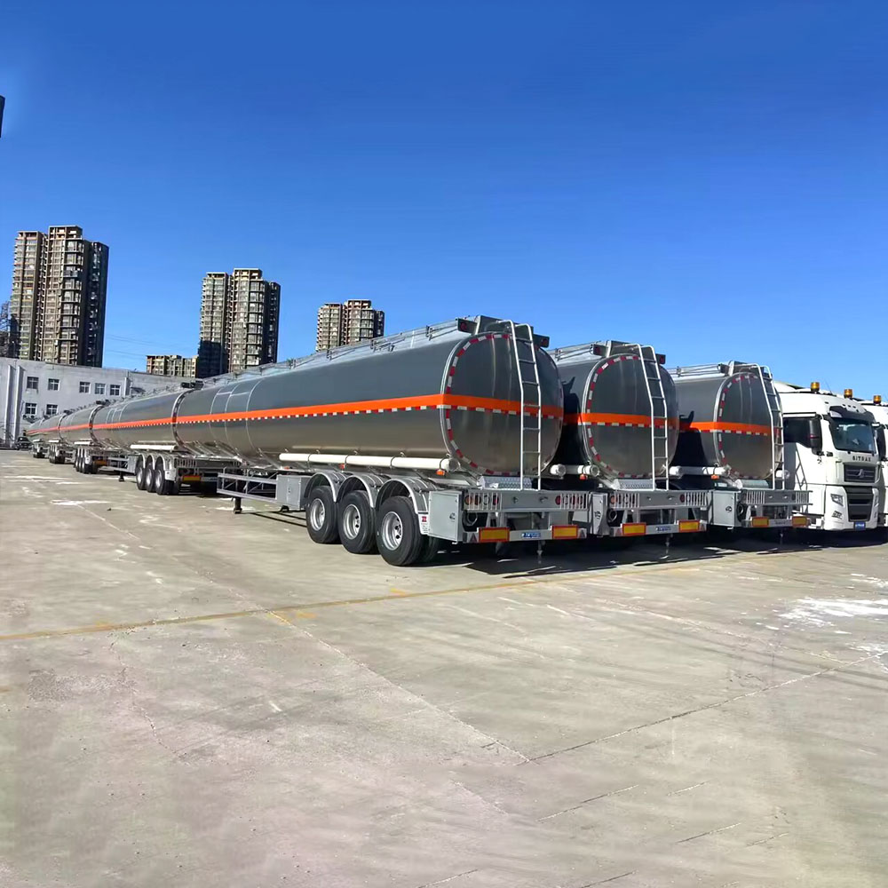 ZW 3 axle aluminum tanker semi trailer with raw alloy finish and orange stripe, optimized for long-distance oil transport.