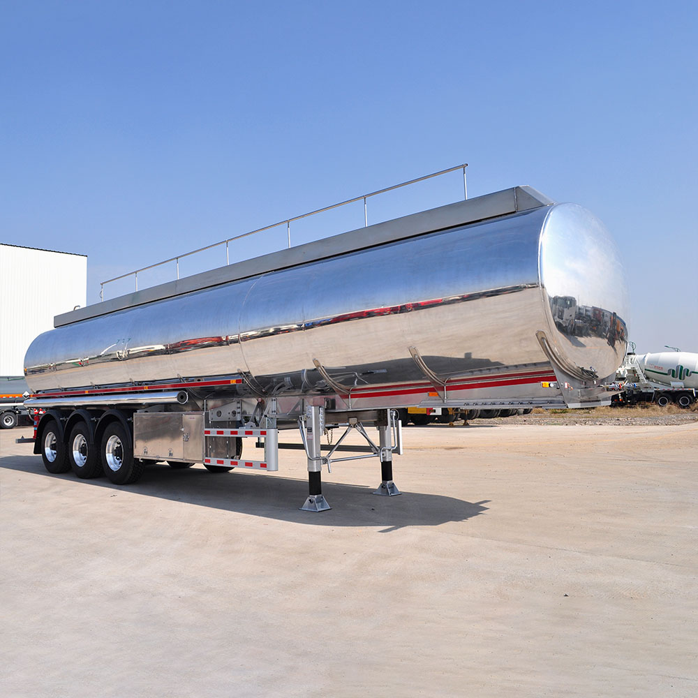 ZW 3 axle polished aluminum tanker trailer with high-capacity tank and lightweight alloy build for fuel and oil transport.