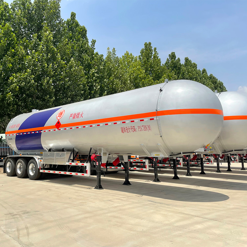 3 axle LPG tanker semi-trailer with carbon steel construction and triple-axle configuration for bulk gas transport.