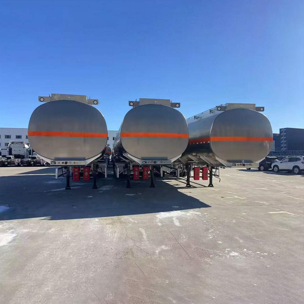 ZW 3 axle aluminum tanker semi trailer with raw alloy finish and orange stripe, optimized for long-distance oil transport.