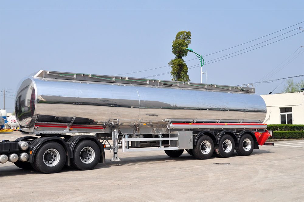 ZW 3 axle polished aluminum tanker trailer with high-capacity tank and lightweight alloy build for fuel and oil transport.