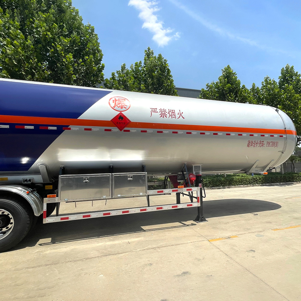 3 axle LPG tanker semi-trailer with carbon steel construction and triple-axle configuration for bulk gas transport.
