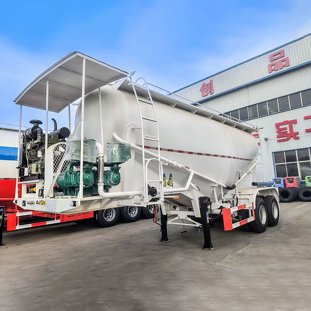 V-shaped cement powder trailer showing discharge valve and dual manholes
