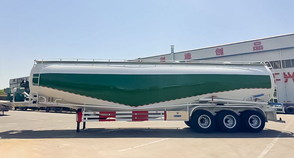 Heavy-duty cement semi-trailer showing W-shaped tank and triple 20T BPW axles