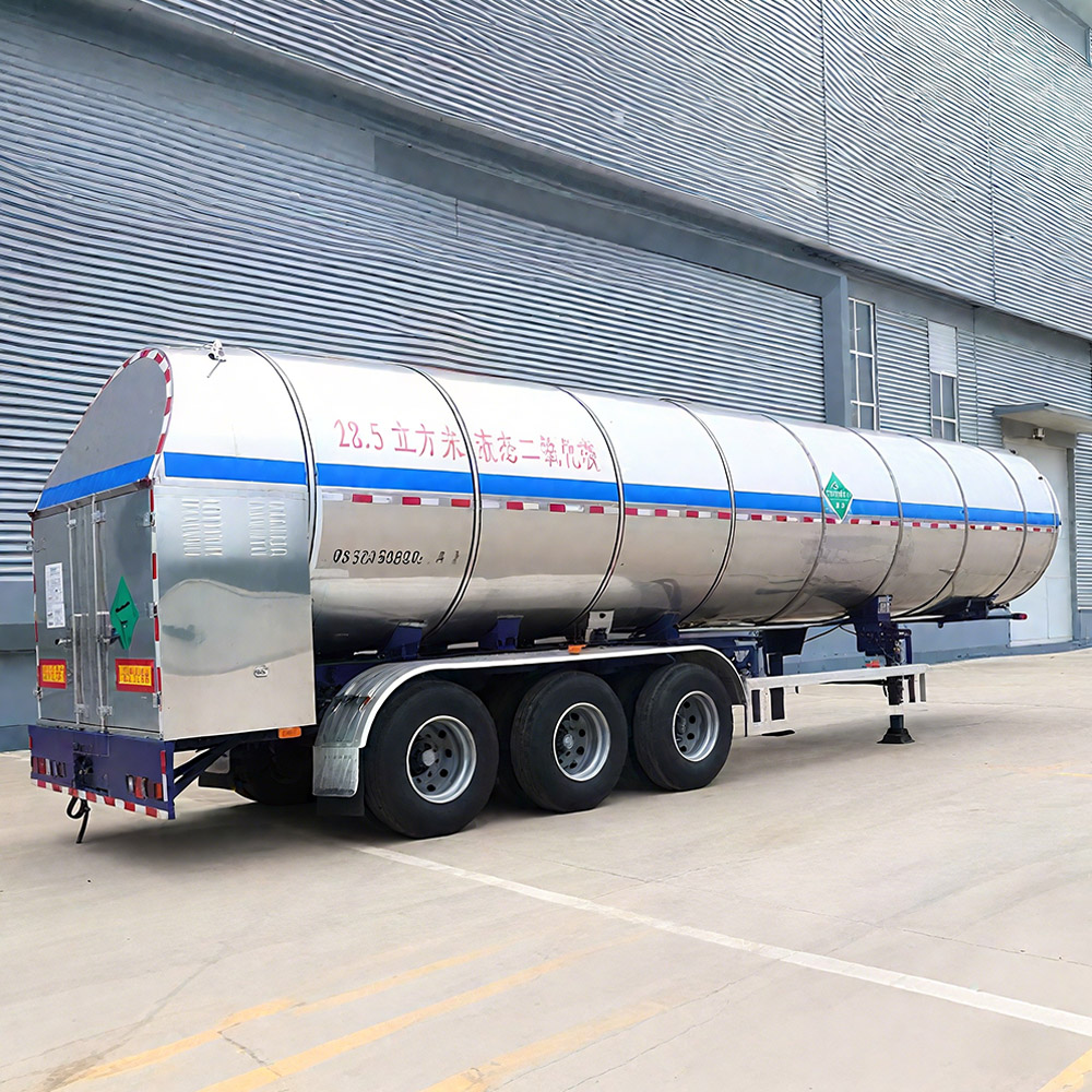 White cryogenic tanker showing vacuum-insulated CO₂ storage unit and triple axles