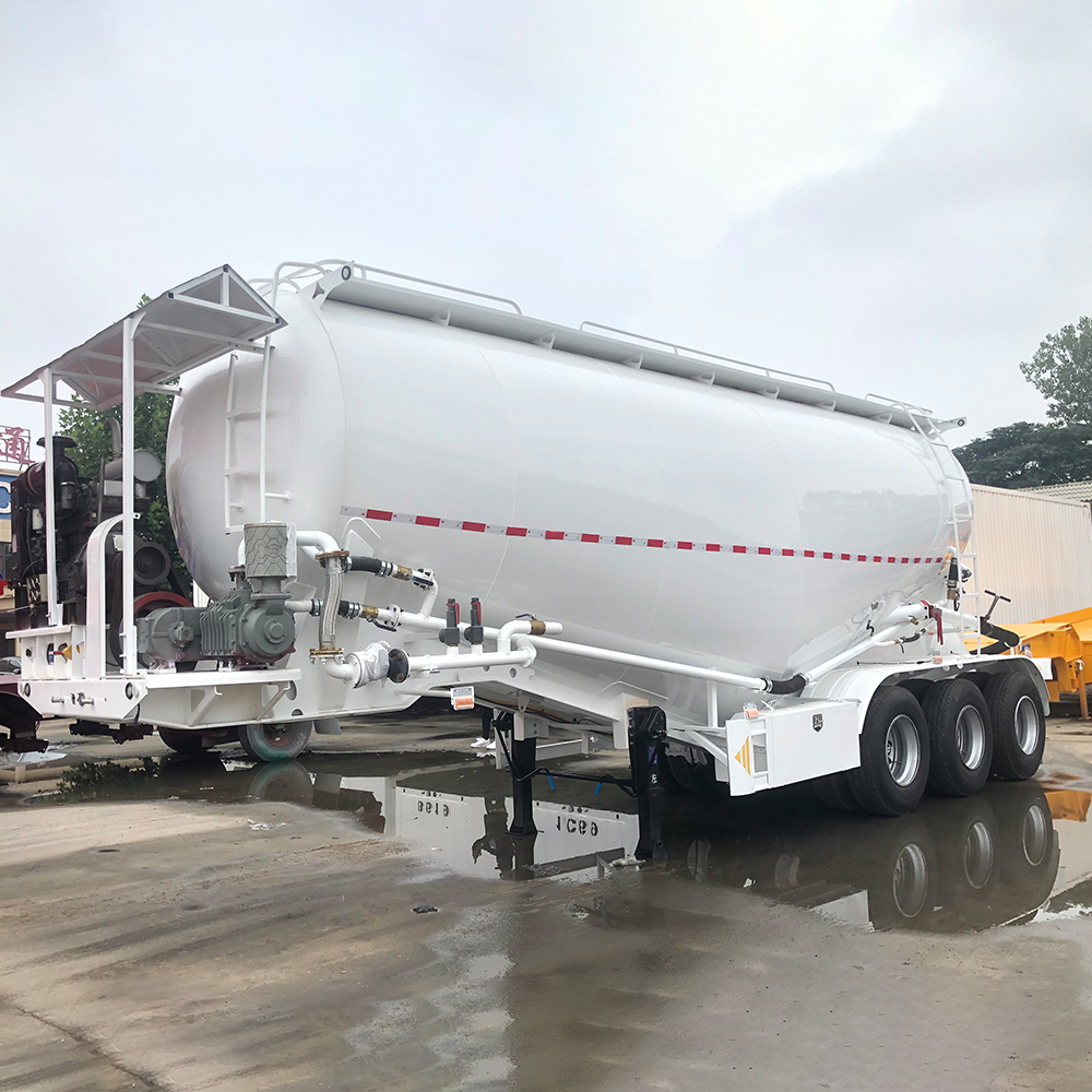 Bulk cement transport trailer showing V-type tank and rear discharge piping