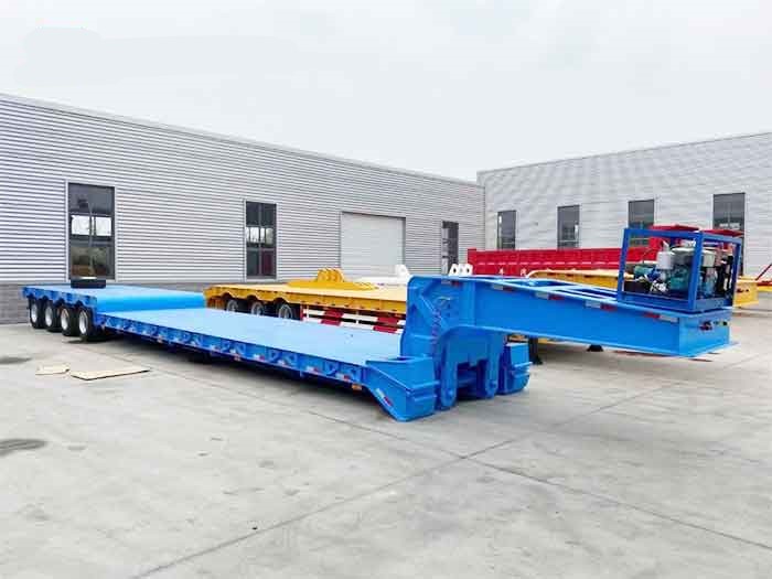 Blue heavy-duty 4 axle RGN trailer for transporting large equipment