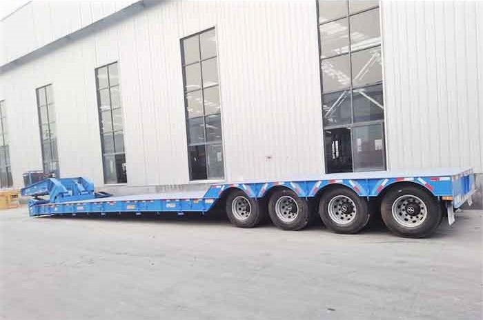 Blue heavy-duty 4 axle RGN trailer for transporting large equipment