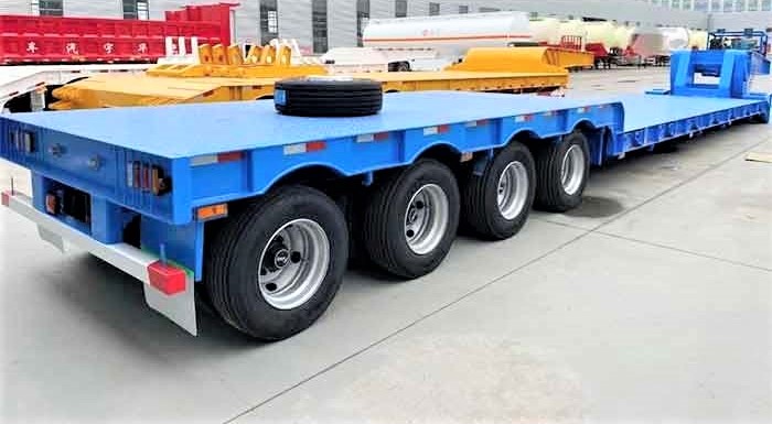 Blue heavy-duty 4 axle RGN trailer for transporting large equipment