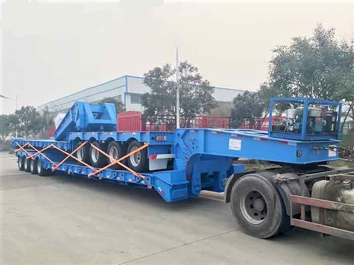 Blue heavy-duty 4 axle RGN trailer for transporting large equipment