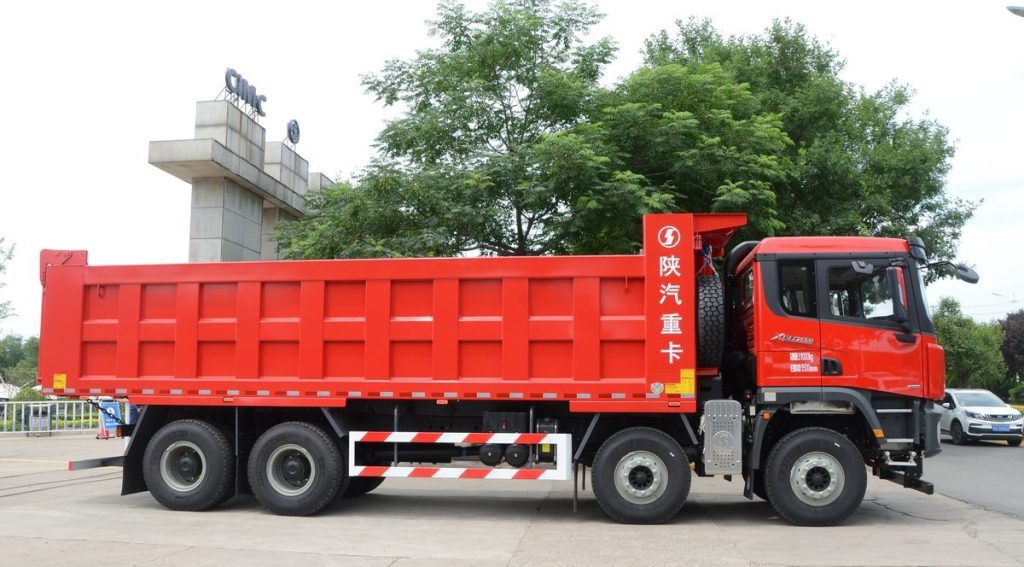 Shacman X3000 8x4 dump truck with 550HP Weichai engine and 8.8-meter cargo box for heavy-duty mining and construction use.